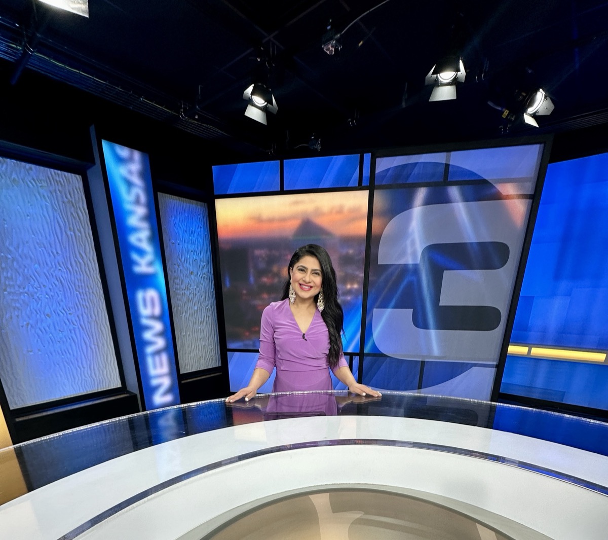 Aditi Lamba at a television news desk.
